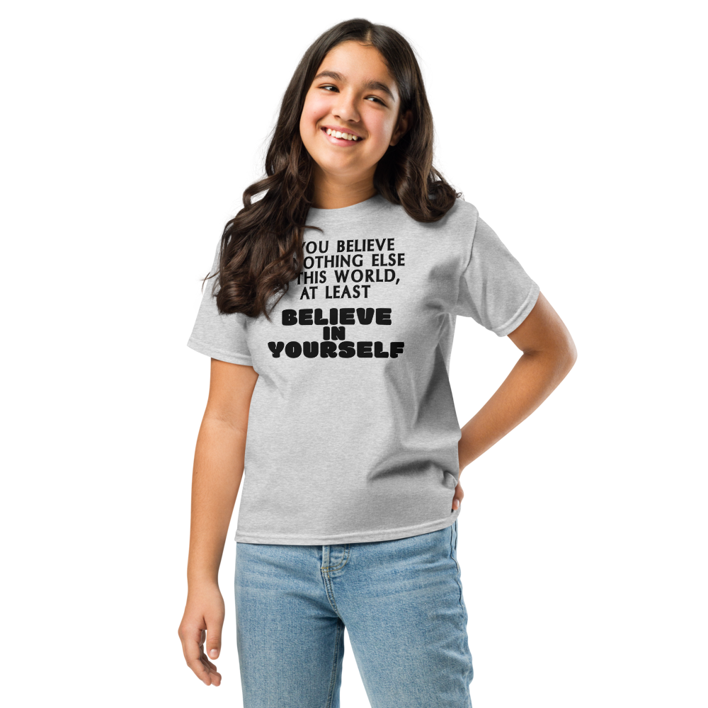 "If you believe in nothing else in this world, at least believe in yourself" printed on a sport grey youth classic tee worn by a female