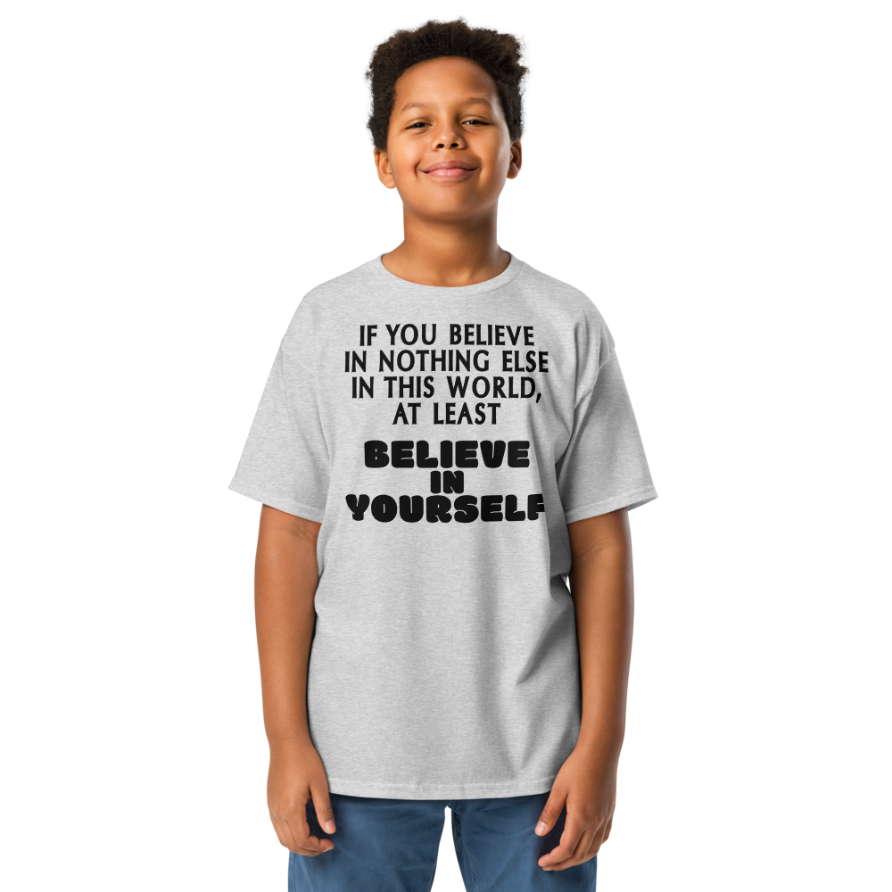 "If you believe in nothing else in this world, at least believe in yourself" printed on a sport grey youth classic tee worn by a male