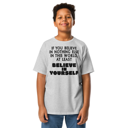 "If you believe in nothing else in this world, at least believe in yourself" printed on a sport grey youth classic tee worn by a male