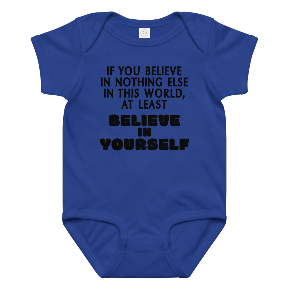"If you believe in nothing else in this world, at least believe in yourself" printed on a royal baby jersey bodysuit laying on a flat surface amongst other clothes