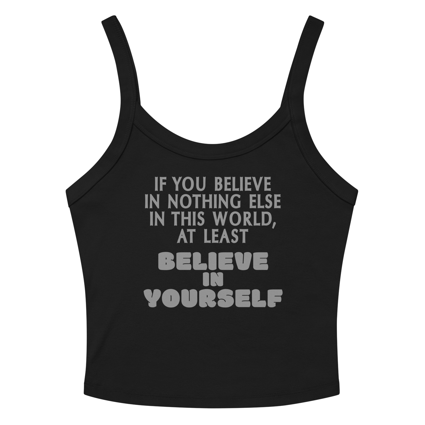 "If you believe in nothing else in this world, at least believe in yourself" printed on a solid black blend women's micro-rib tanktop laying on a flat surface amongst sunglasses and shorts