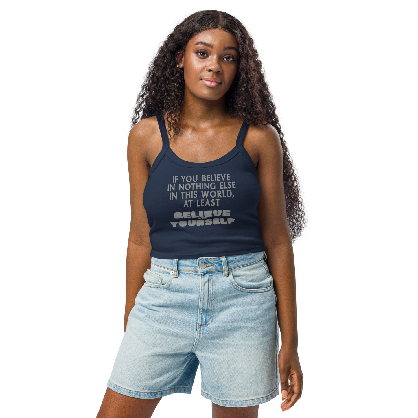 "If you believe in nothing else in this world, at least believe in yourself" printed on a solid navy blend women's micro-rib tanktop worn by a female