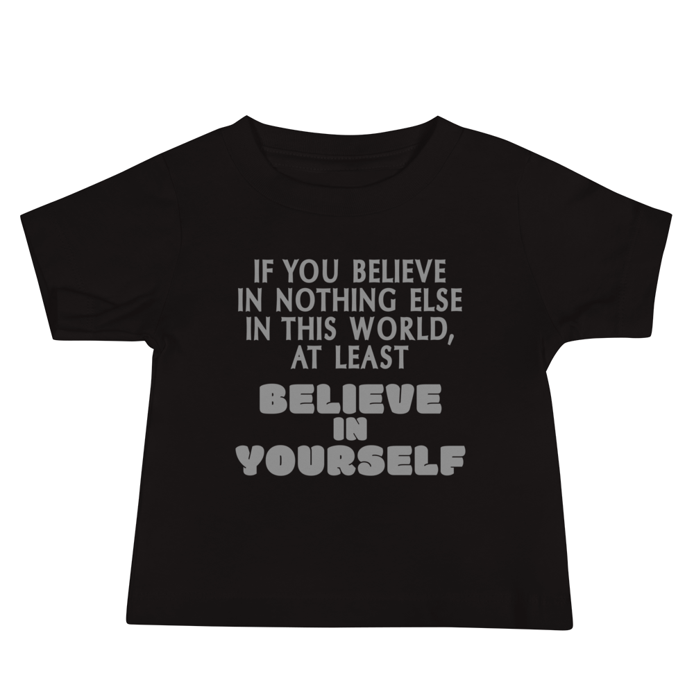 "If you believe in nothing else in this world, at least believe in yourself" printed on a black baby jersey short sleeve tee laying on a flat surface