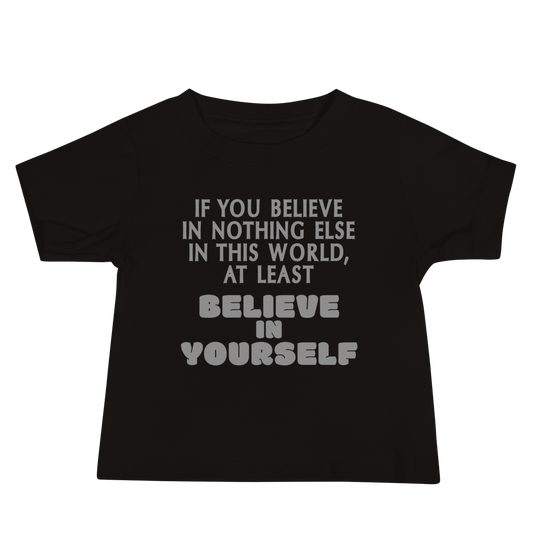 "If you believe in nothing else in this world, at least believe in yourself" printed on a black baby jersey short sleeve tee laying on a flat surface