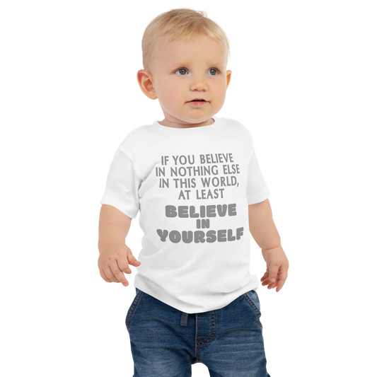 "If you believe in nothing else in this world, at least believe in yourself" printed on a white baby jersey short sleeve tee worn by a male
