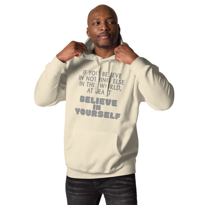 "If you believe in nothing else in this world, at least believe in yourself" printed on a bone unisex hoodie worn by a male