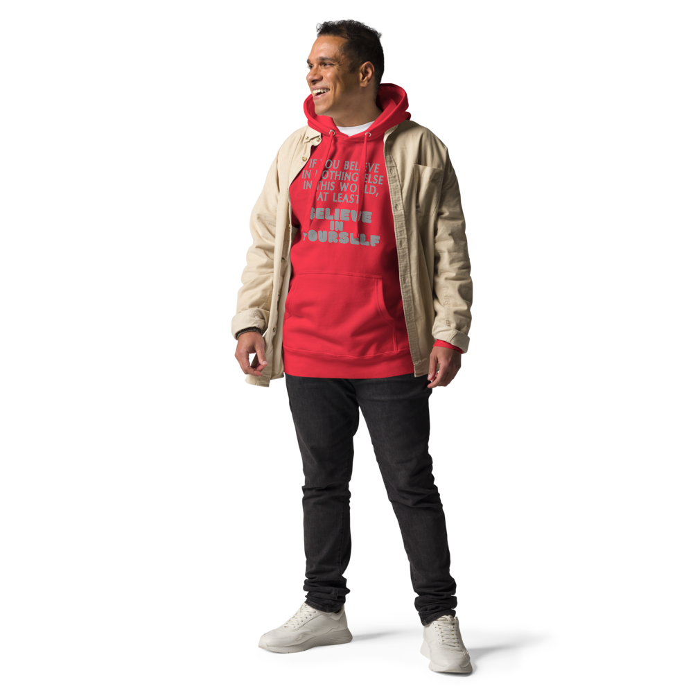 "If you believe in nothing else in this world, at least believe in yourself" printed on a team red unisex hoodie worn by a male with a jacket on top
