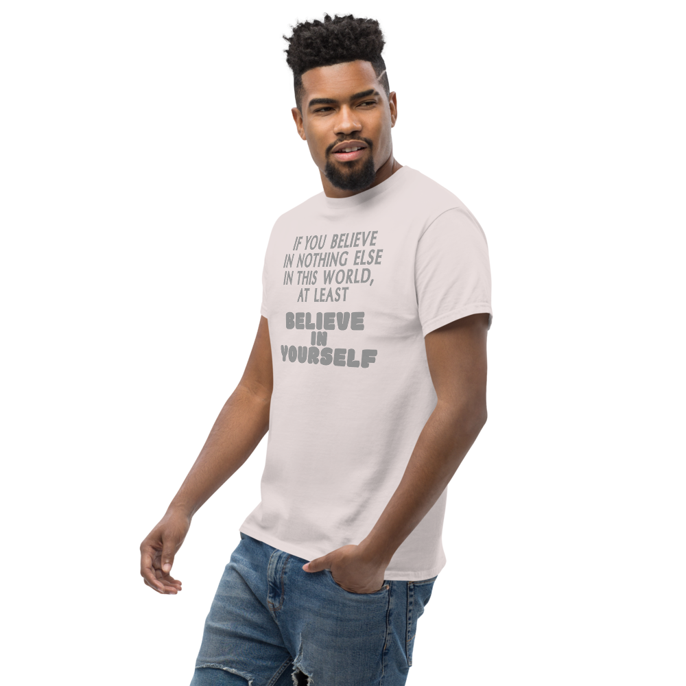 "If you believe in nothing else in this world, at least believe in yourself" printed on a ice grey unisex classic tee worn by a male