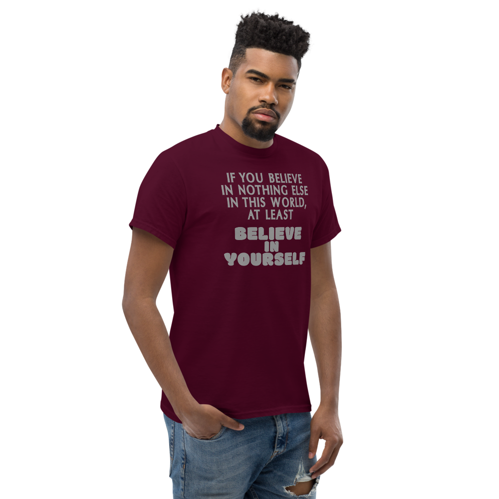 "If you believe in nothing else in this world, at least believe in yourself" printed on a maroon unisex classic tee worn by a male