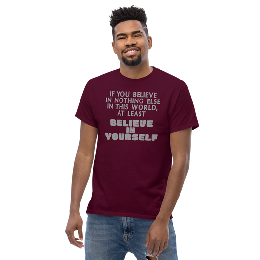 "If you believe in nothing else in this world, at least believe in yourself" printed on a maroon unisex classic tee worn by a male