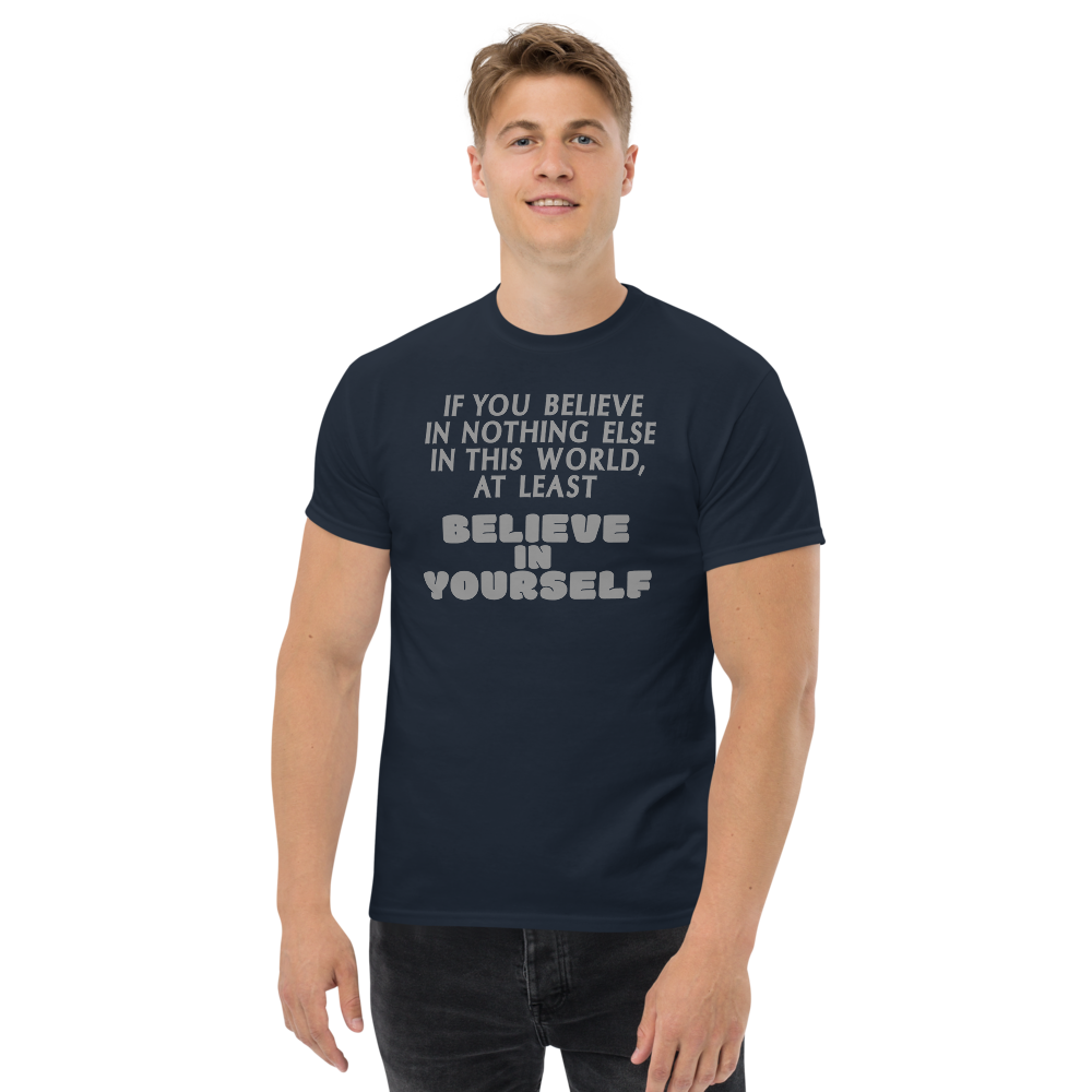 "If you believe in nothing else in this world, at least believe in yourself" printed on a navy unisex classic tee worn by a male