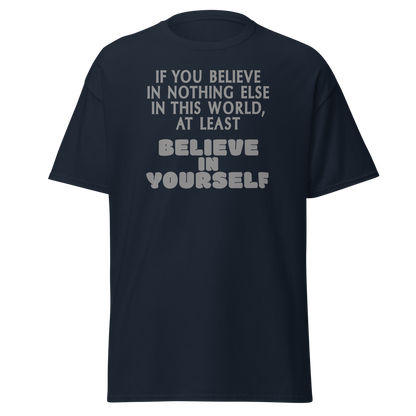 "If you believe in nothing else in this world, at least believe in yourself" printed on a navy unisex classic tee laying on a flat surface