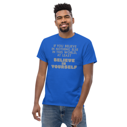 "If you believe in nothing else in this world, at least believe in yourself" printed on a royal unisex classic tee worn by a male