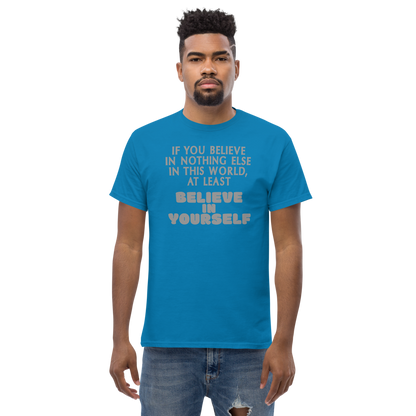 "If you believe in nothing else in this world, at least believe in yourself" printed on a sapphire unisex classic tee worn by a male