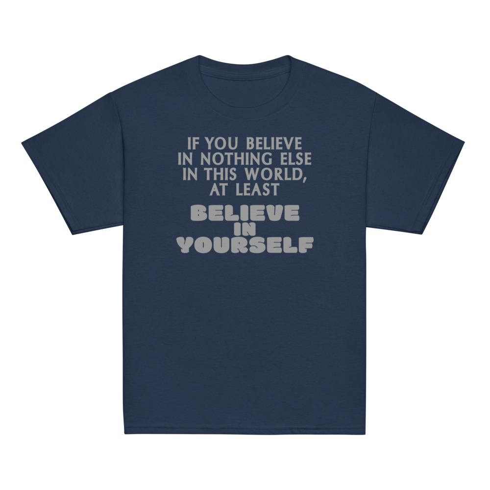 "If you believe in nothing else in this world, at least believe in yourself" printed on a navy youth classic tee laying on a flat surface