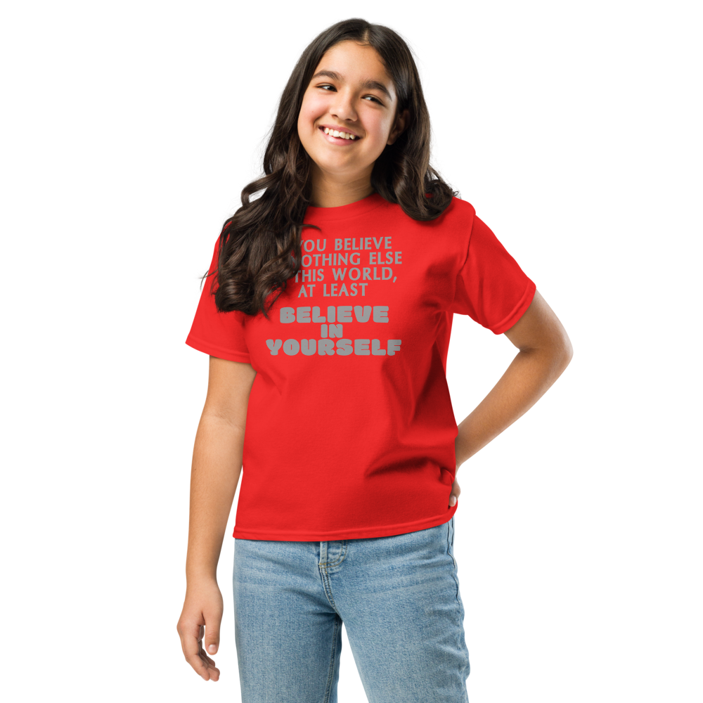 "If you believe in nothing else in this world, at least believe in yourself" printed on a red youth classic tee worn by a female