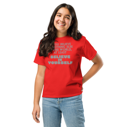 "If you believe in nothing else in this world, at least believe in yourself" printed on a red youth classic tee worn by a female
