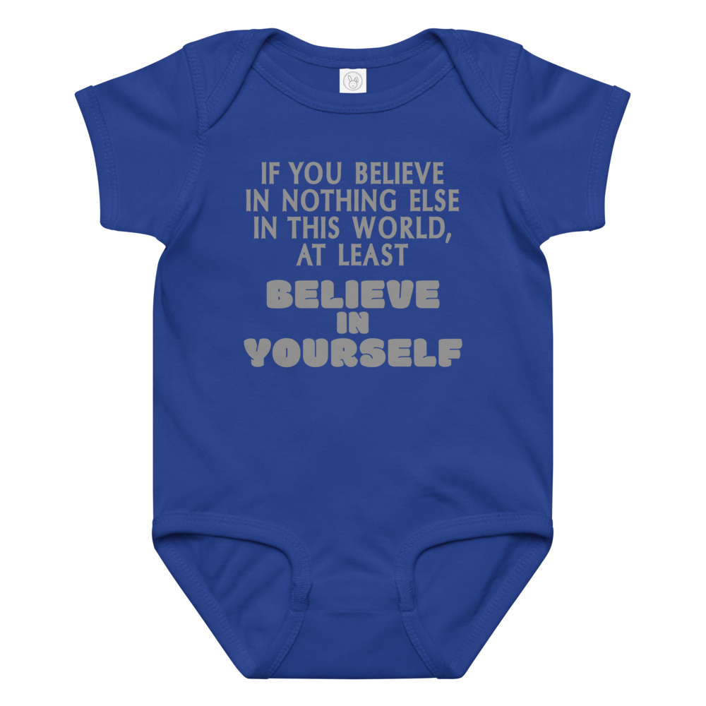 "If you believe in nothing else in this world, at least believe in yourself" printed on a royal baby jersey bodysuit laying on a flat surface amongst other clothes