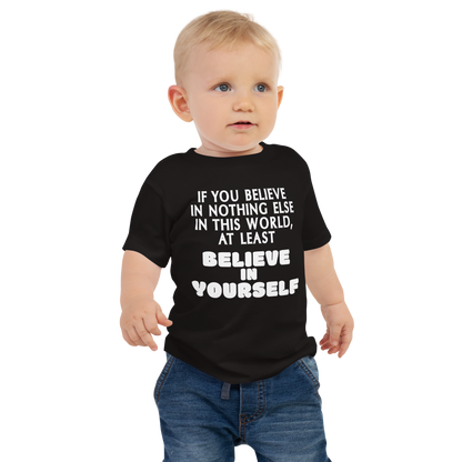 "If you believe in nothing else in this world, at least believe in yourself" printed on a black baby jersey short sleeve tee worn by a male