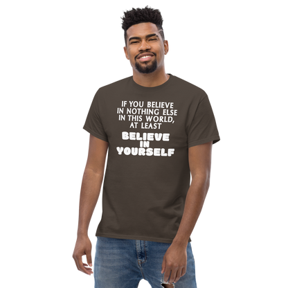 "If you believe in nothing else in this world, at least believe in yourself" printed on a dark chocolate unisex classic tee worn by a male