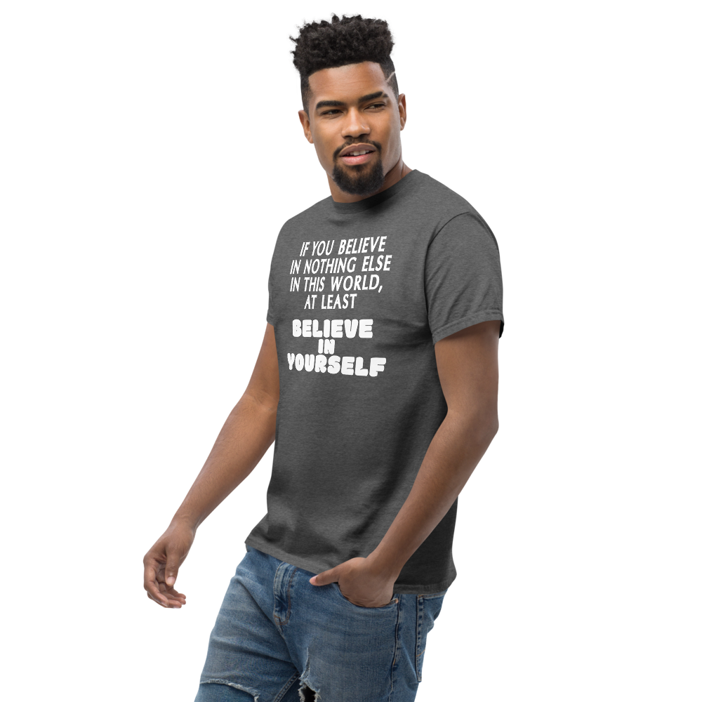"If you believe in nothing else in this world, at least believe in yourself" printed on a dark heather unisex classic tee worn by a male