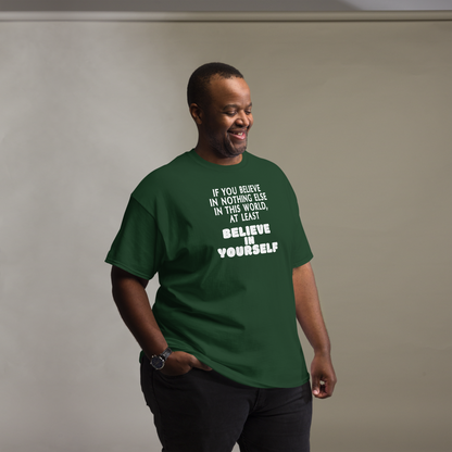 "If you believe in nothing else in this world, at least believe in yourself" printed on a forest green unisex classic tee worn by a male