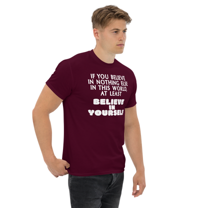 "If you believe in nothing else in this world, at least believe in yourself" printed on a maroon unisex classic tee worn by a male