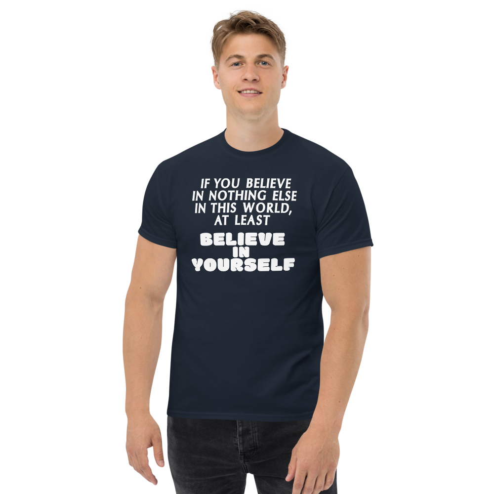 "If you believe in nothing else in this world, at least believe in yourself" printed on a navy unisex classic tee worn by a male