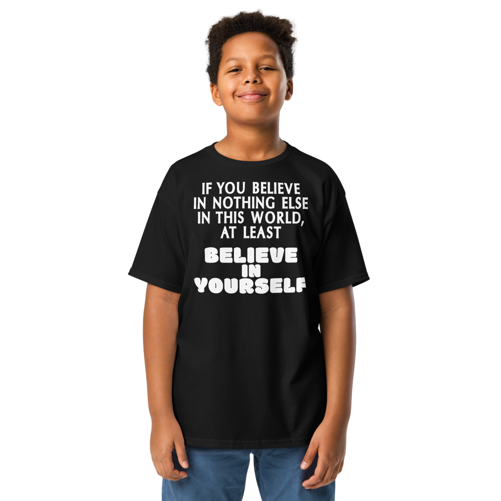 "If you believe in nothing else in this world, at least believe in yourself" printed on a black youth classic tee worn by a male