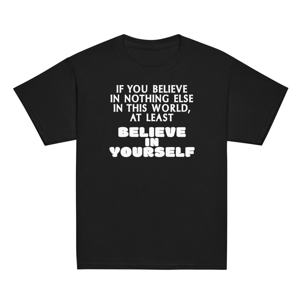 "If you believe in nothing else in this world, at least believe in yourself" printed on a black youth classic tee laying on a flat surface