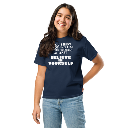 "If you believe in nothing else in this world, at least believe in yourself" printed on a navy youth classic tee worn by a female