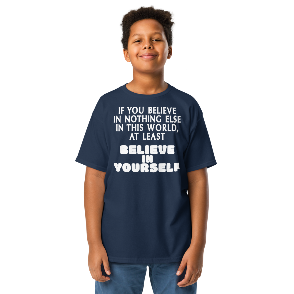 "If you believe in nothing else in this world, at least believe in yourself" printed on a navy youth classic tee worn by a male