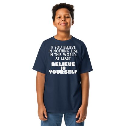 "If you believe in nothing else in this world, at least believe in yourself" printed on a navy youth classic tee worn by a male