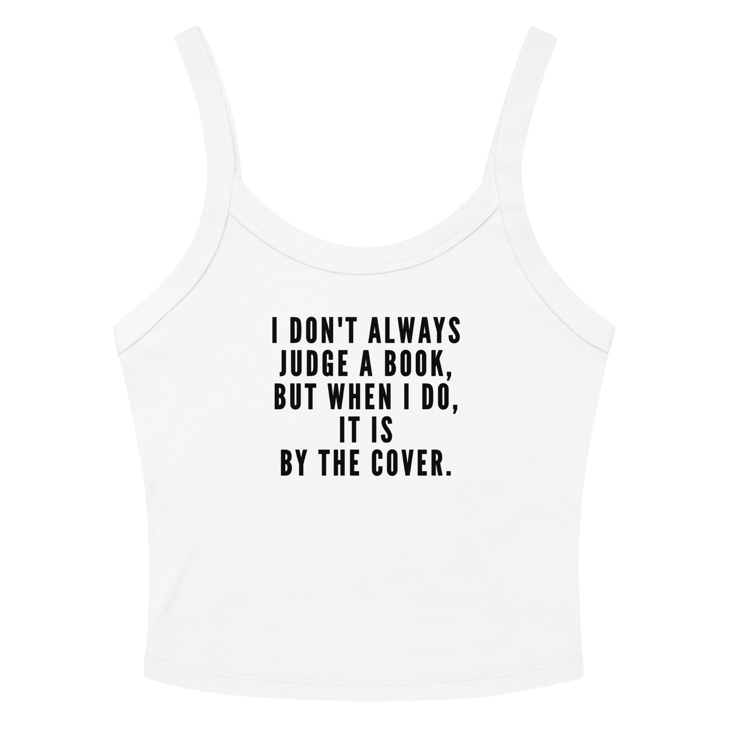 "I Don't always Judge a Book, but when I do, it's by the cover." printed on a solid white blend women's micro-rib tanktop laying on a flat surface amongst sunglasses and shorts