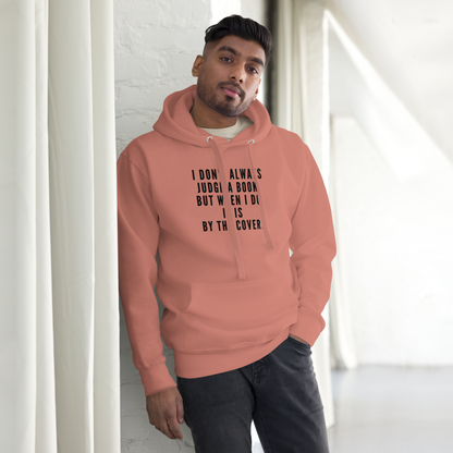 "I Don't always Judge a Book, but when I do, it's by the cover." printed on a dusty rose unisex hoodie worn by a male