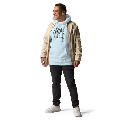 "I Don't always Judge a Book, but when I do, it's by the cover." printed on a sky blue unisex hoodie worn by a male with a jacket on top