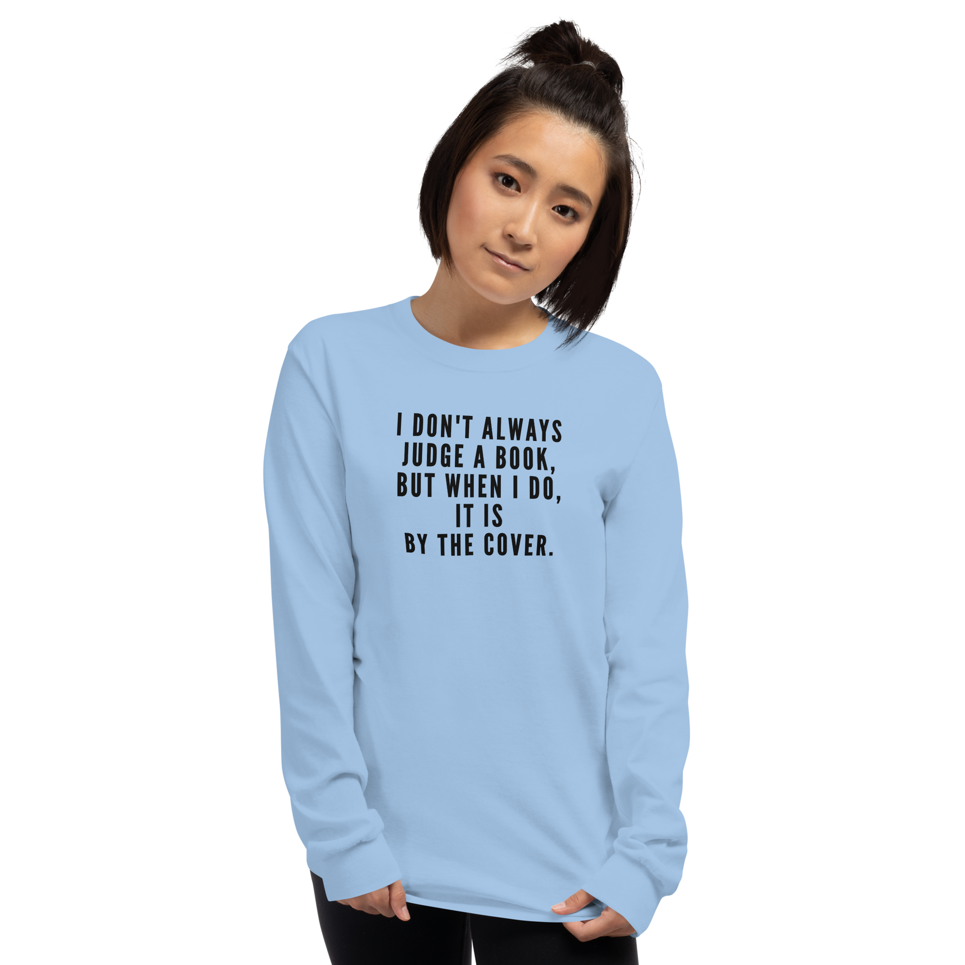 "I Don't always Judge a Book, but when I do, it's by the cover." printed on a light blue men's long sleeve shirt worn by a female