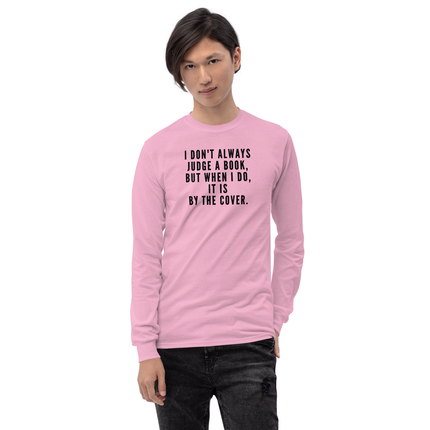 "I Don't always Judge a Book, but when I do, it's by the cover." printed on a light pink men's long sleeve shirt worn by a male