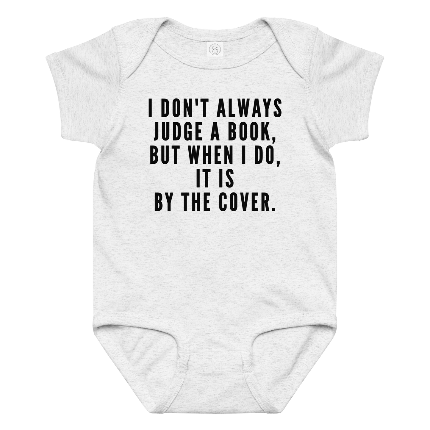 "I Don't always Judge a Book, but when I do, it's by the cover." printed on a ash baby jersey bodysuit laying on a flat surface amongst other clothes