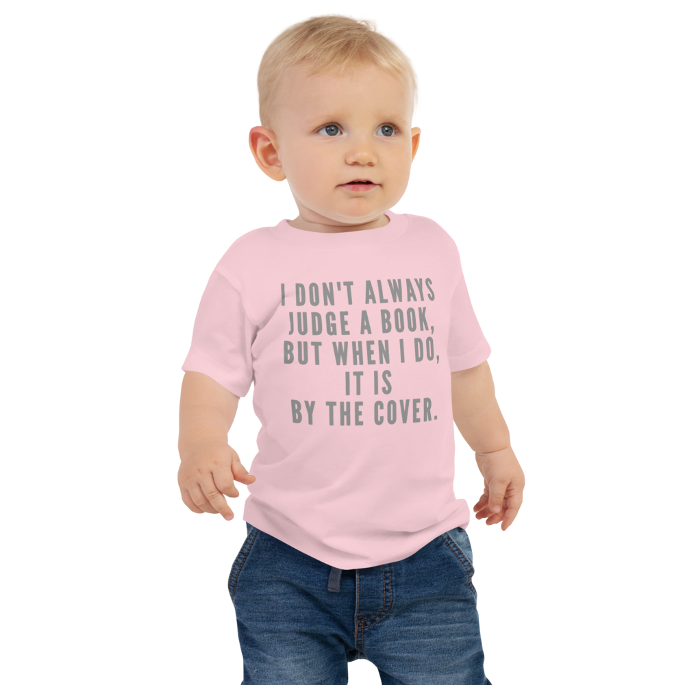 "I Don't always Judge a Book, but when I do, it's by the cover." printed on a pink baby jersey short sleeve tee worn by a male