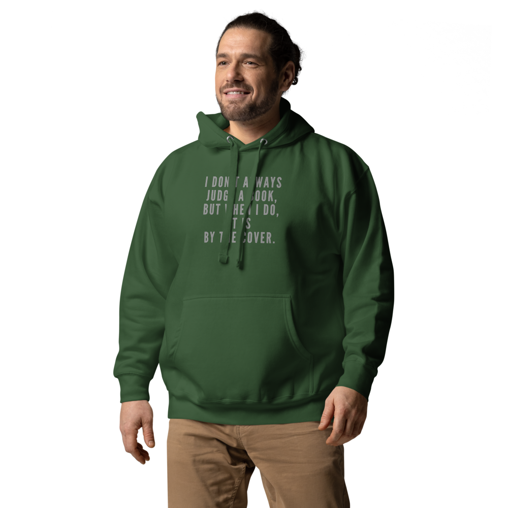 "I Don't always Judge a Book, but when I do, it's by the cover." printed on a forest green unisex hoodie worn by a male