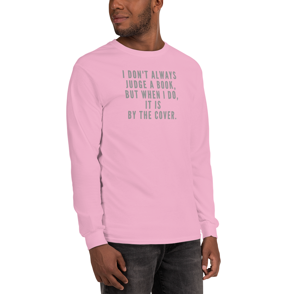 "I Don't always Judge a Book, but when I do, it's by the cover." printed on a light pink men's long sleeve shirt worn by a male