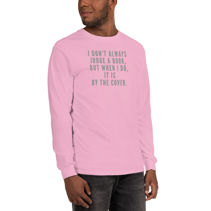 "I Don't always Judge a Book, but when I do, it's by the cover." printed on a light pink men's long sleeve shirt worn by a male