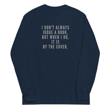 "I Don't always Judge a Book, but when I do, it's by the cover." printed on a navy men's long sleeve shirt laying on a flat surface