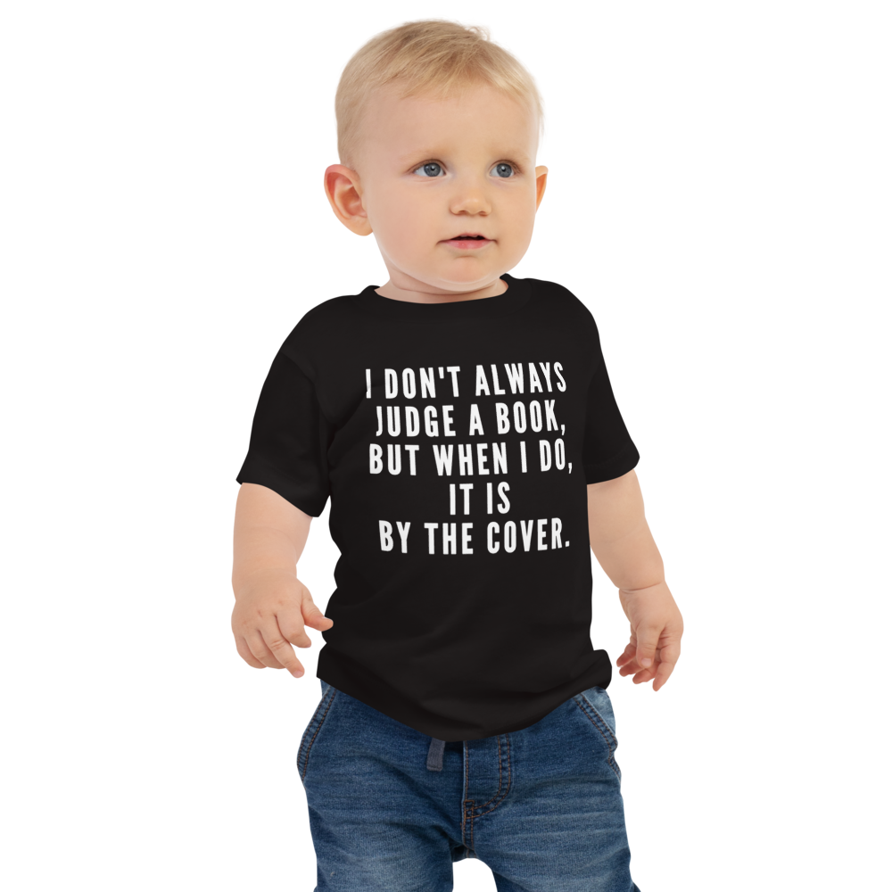 "I Don't always Judge a Book, but when I do, it's by the cover." printed on a black baby jersey short sleeve tee worn by a male