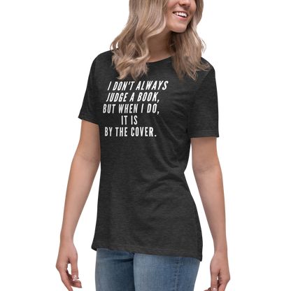 "I Don't always Judge a Book, but when I do, it's by the cover." printed on a dark grey heather women's relaxed t-shirt worn by a female