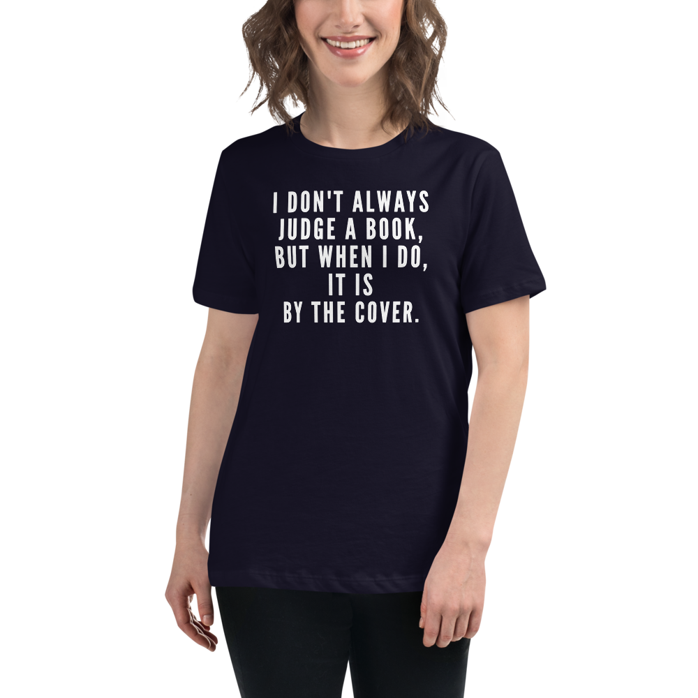 "I Don't always Judge a Book, but when I do, it's by the cover." printed on a navy women's relaxed t-shirt worn by a female