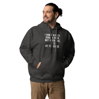 "I Don't always Judge a Book, but when I do, it's by the cover." printed on a charcoal heather unisex hoodie worn by a male