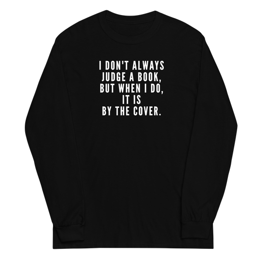 "I Don't always Judge a Book, but when I do, it's by the cover." printed on a black men's long sleeve shirt laying on a flat surface