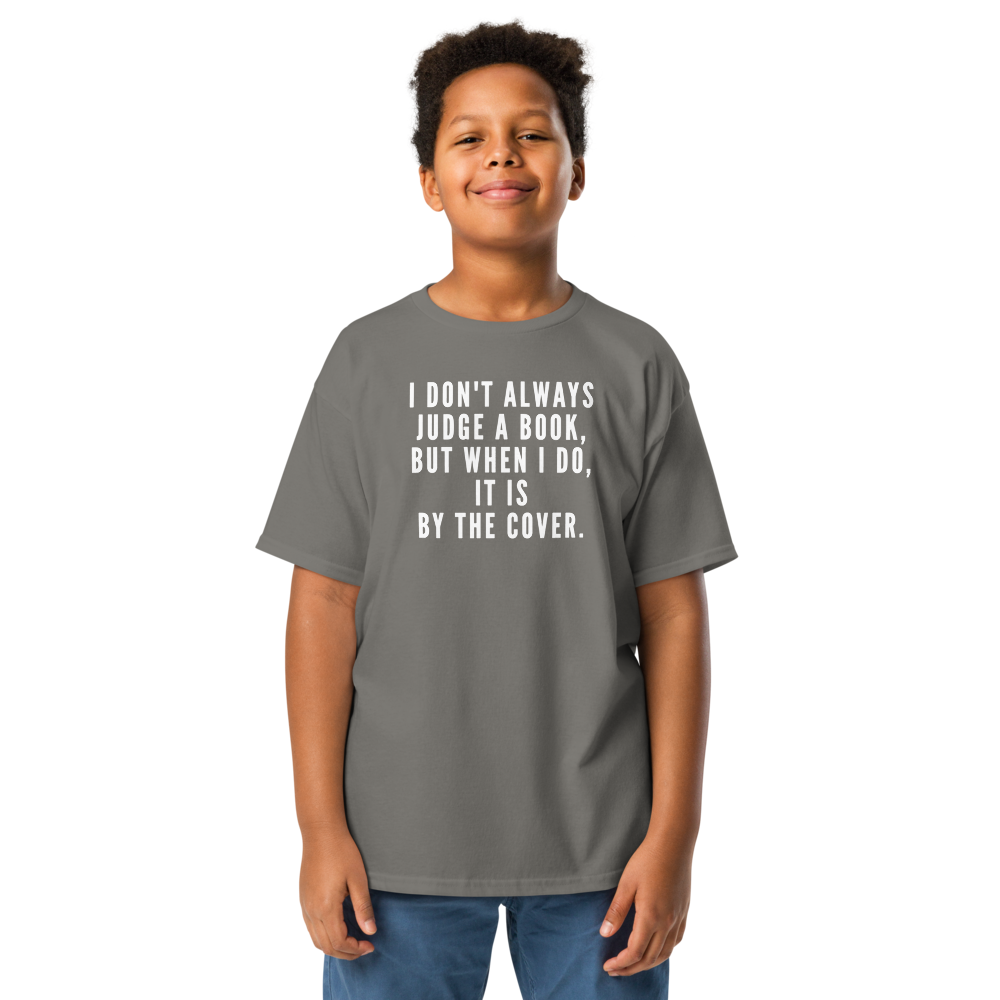 "I Don't always Judge a Book, but when I do, it's by the cover." printed on a charcoal youth classic tee worn by a male